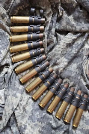 Сувенір стрічка кулеметна 12.7х99 14 гільз Харків